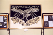 Il quadro dipinto da Antonio Sampaolo e raffigurante lo stemma ideato da D'Annunzio per la Comina, esposto alla Mostra Storica