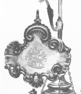shade of a silver oil lamp